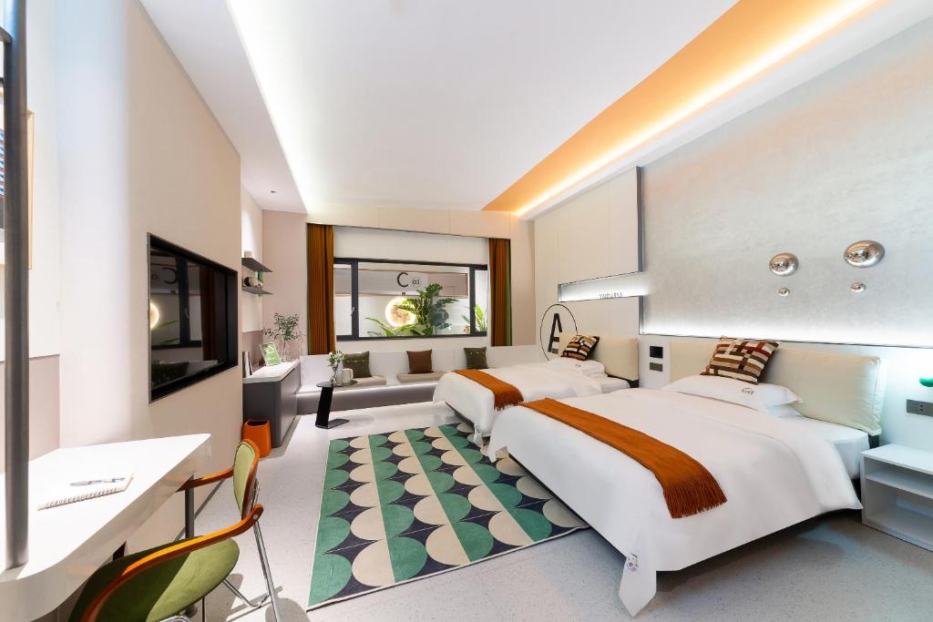 Postel nebo postele na pokoji v ubytování Vishan Keys Hotel 维尚潮宿