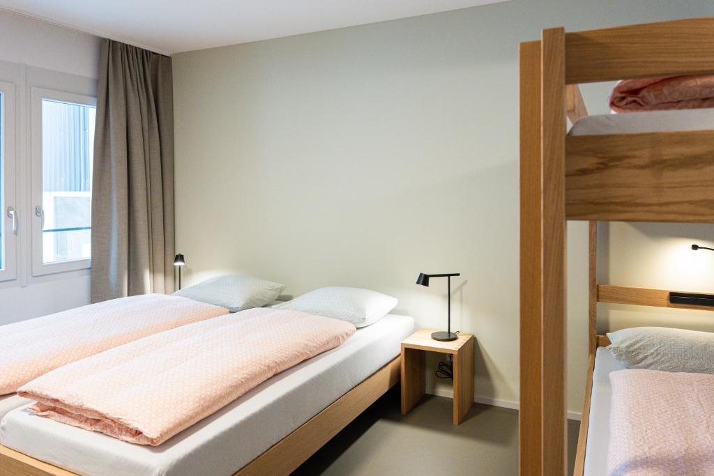 Voodi või voodid majutusasutuse Martigny Youth Hostel toas