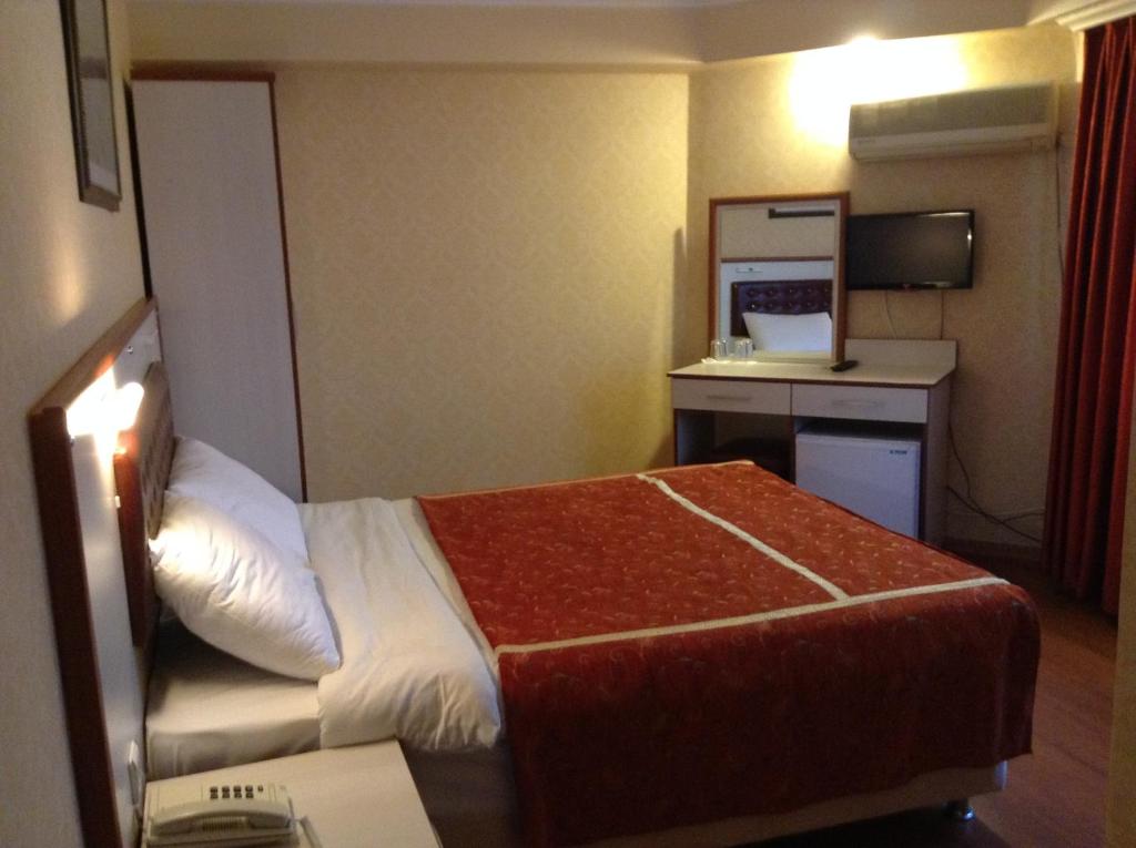 Ліжко або ліжка в номері Tayhan Hotel