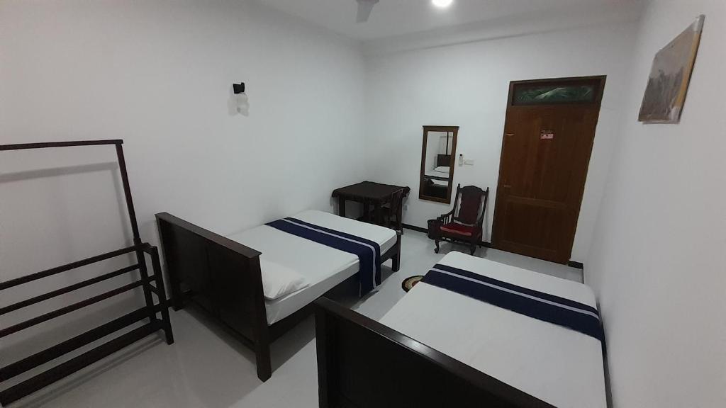 Postel nebo postele na pokoji v ubytování Hotel Sanhida Polonnaruwa