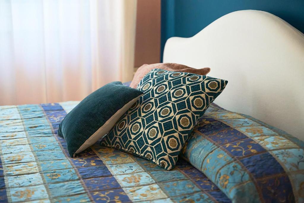 Llit o llits en una habitació de Hotel Belvedere Ranco