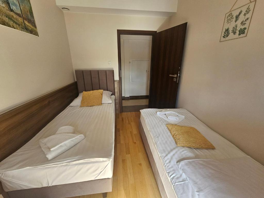 Posteľ alebo postele v izbe v ubytovaní Apartament Perła A20 nad jeziorem Pluszne