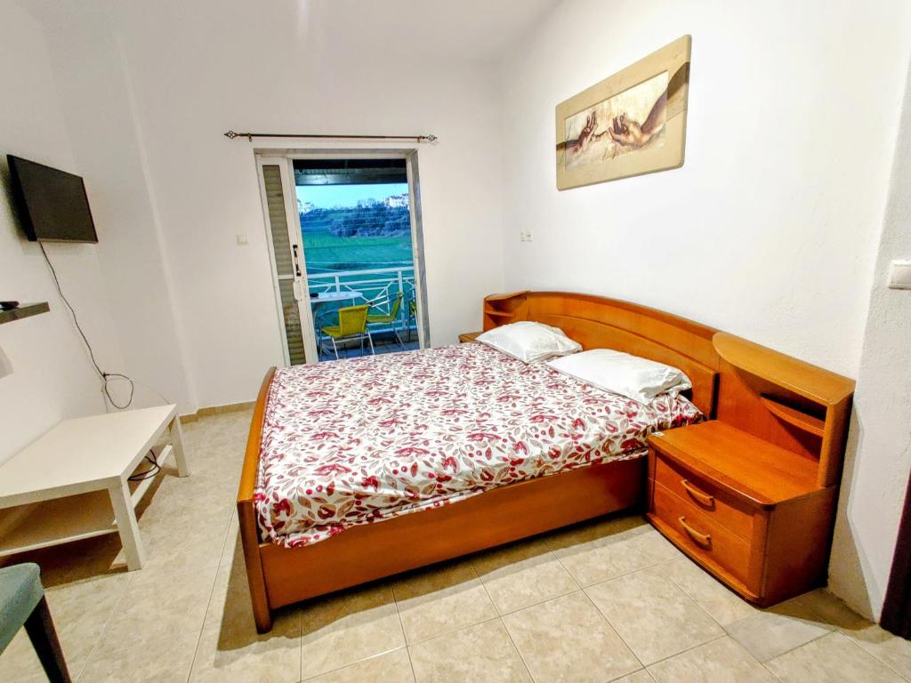 Postel nebo postele na pokoji v ubytování FLOGITA - 5 Beautiful Apartments