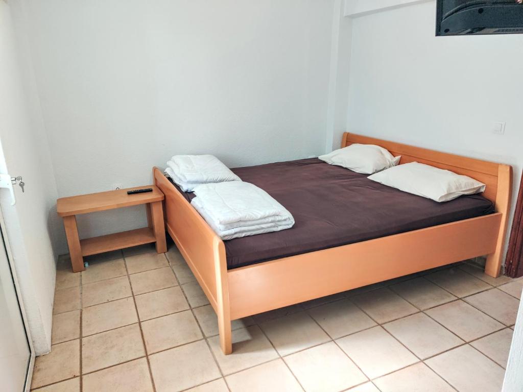 Postel nebo postele na pokoji v ubytování FLOGITA - 5 Beautiful Apartments