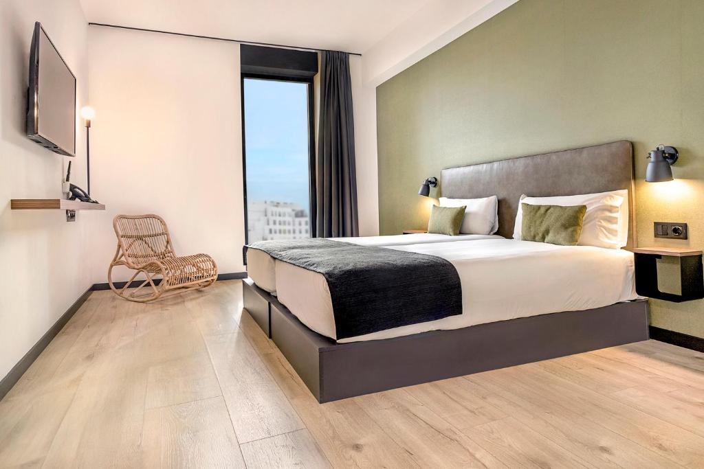 Posteľ alebo postele v izbe v ubytovaní Hotel Orangine