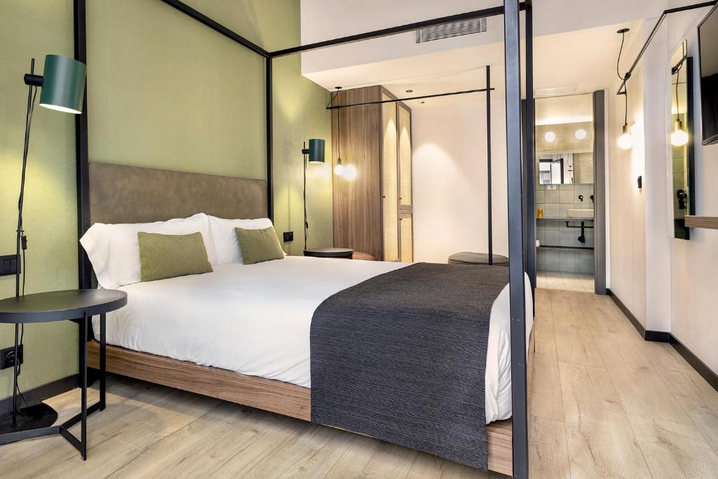 Posteľ alebo postele v izbe v ubytovaní Hotel Orangine