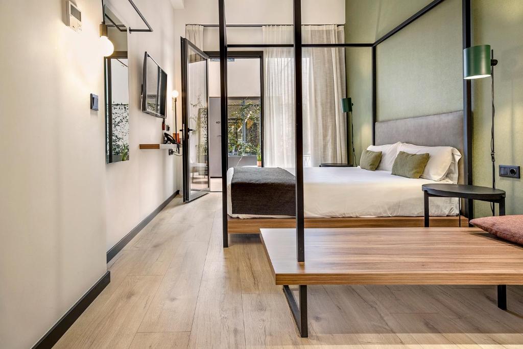 Posteľ alebo postele v izbe v ubytovaní Hotel Orangine