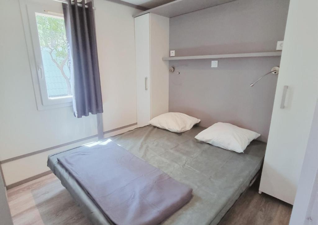 Postel nebo postele na pokoji v ubytování Camping Mulinacciu