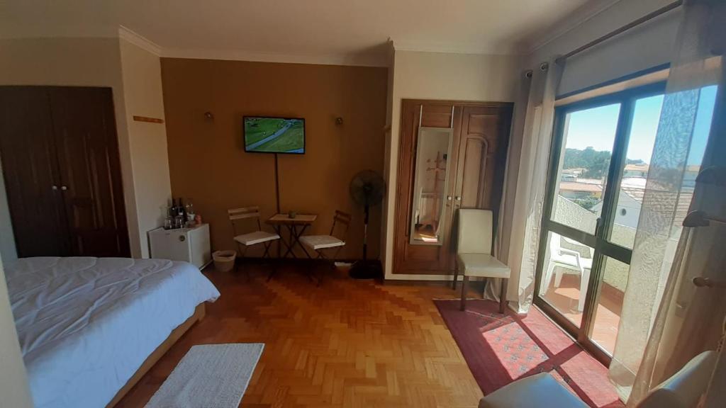 Postel nebo postele na pokoji v ubytování Morada do Ultramar