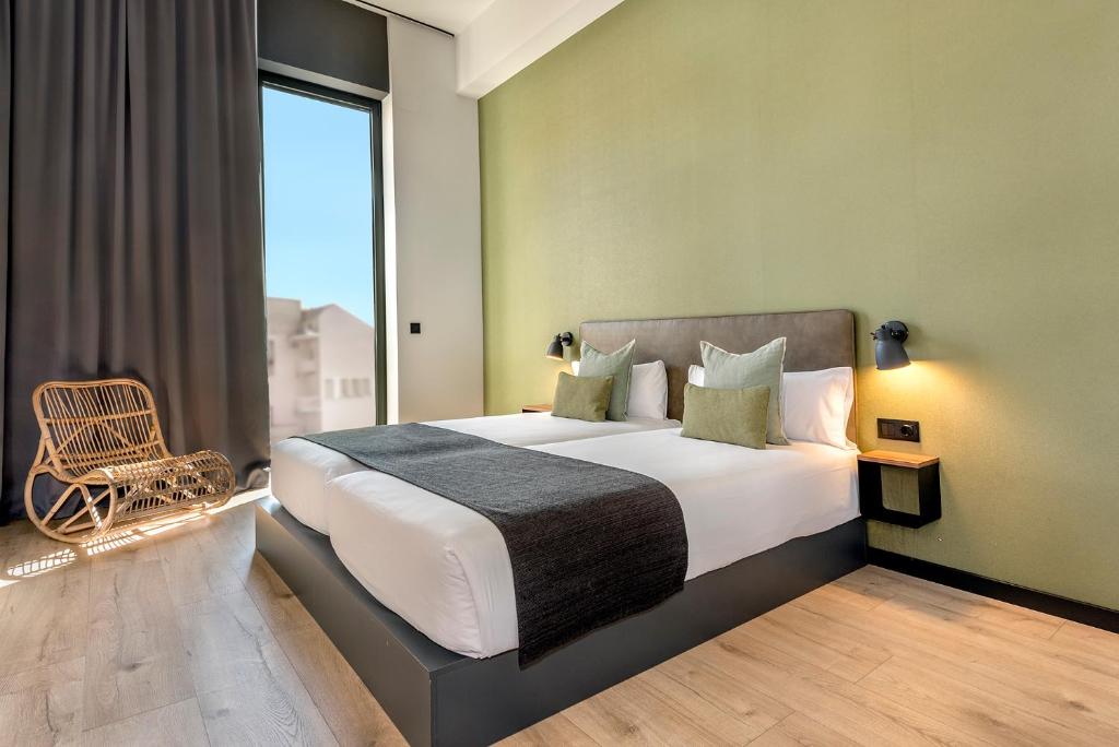 Posteľ alebo postele v izbe v ubytovaní Hotel Orangine