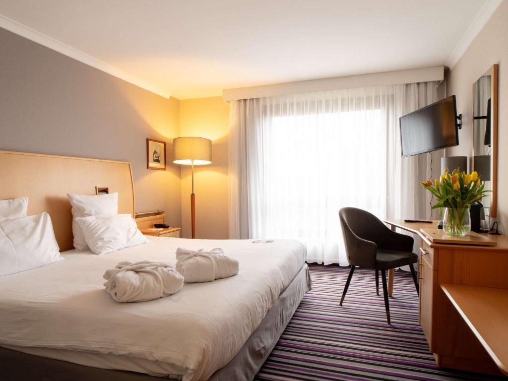 Posteľ alebo postele v izbe v ubytovaní Mercure Cieszyn