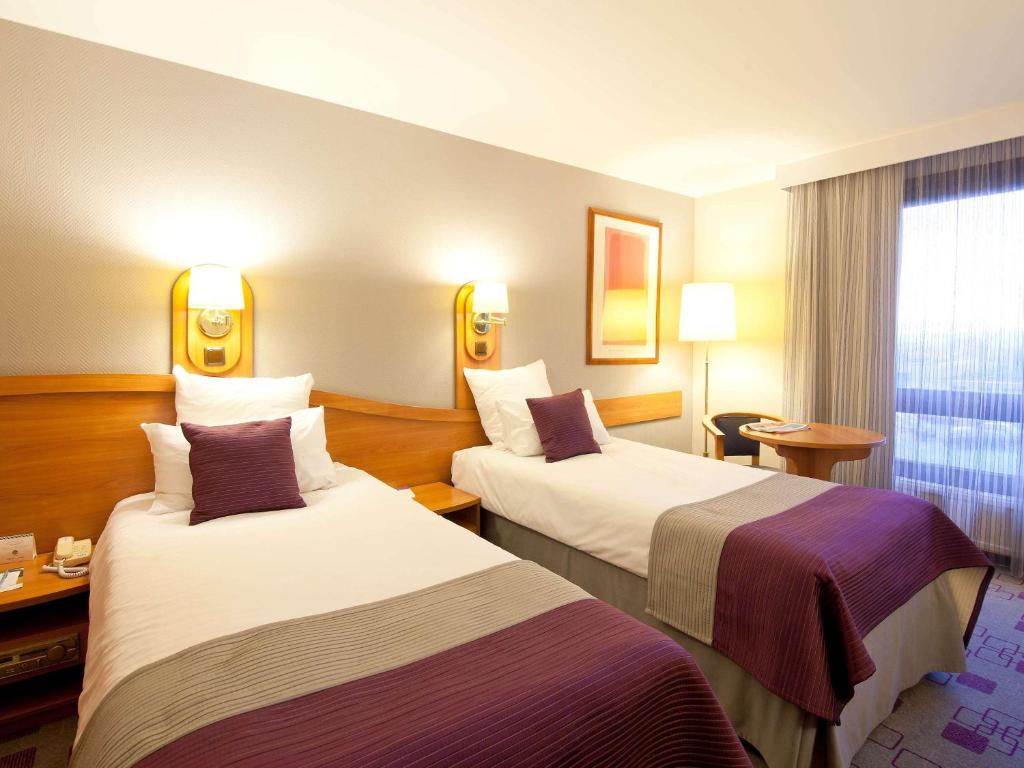 Posteľ alebo postele v izbe v ubytovaní Mercure Cieszyn