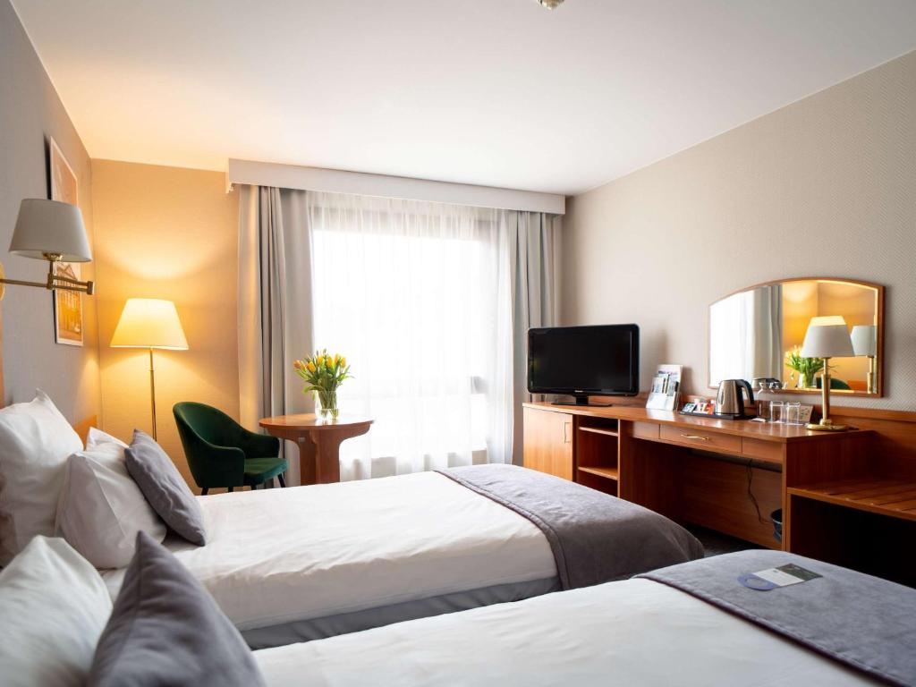Posteľ alebo postele v izbe v ubytovaní Mercure Cieszyn