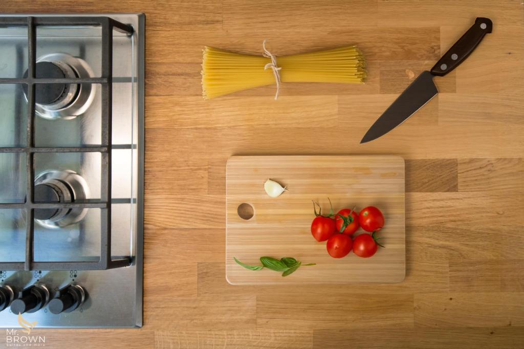 A kitchen or kitchenette at Mr Brown Home and suites