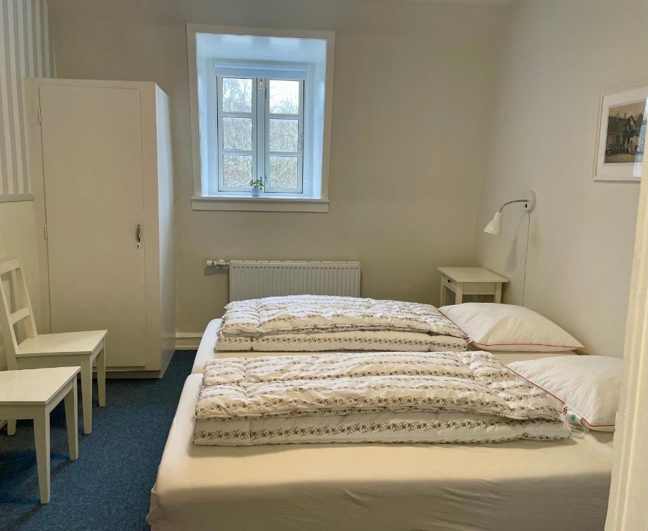 Postel nebo postele na pokoji v ubytování Korinth Kro Hostel