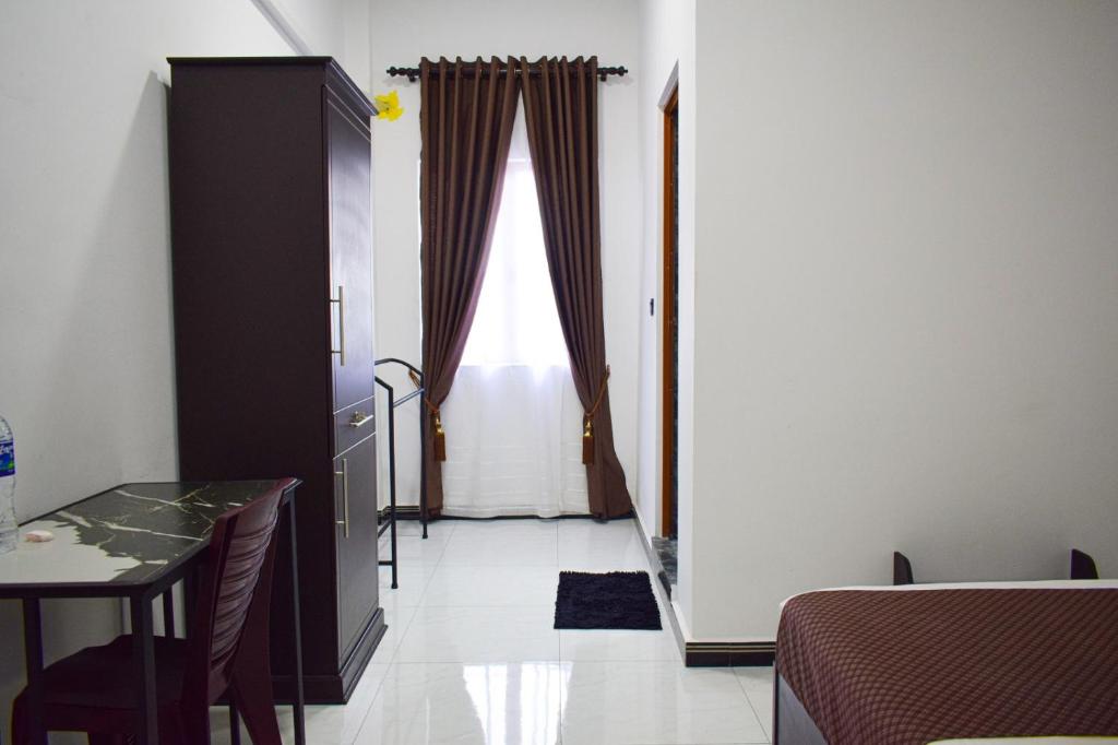 Postel nebo postele na pokoji v ubytování SSS HOTEL