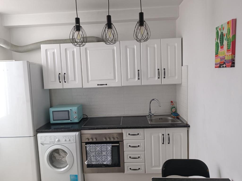 A kitchen or kitchenette at Fantástico piso en el centro 2°linea de playa