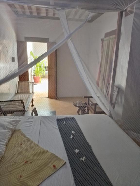 Postel nebo postele na pokoji v ubytování Ajooba