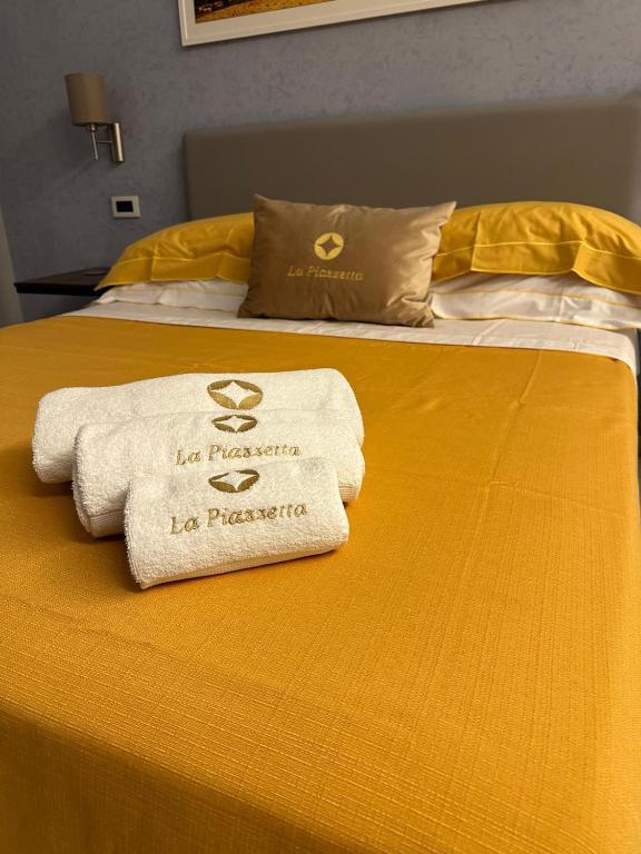 Posteľ alebo postele v izbe v ubytovaní B&B La Piazzetta