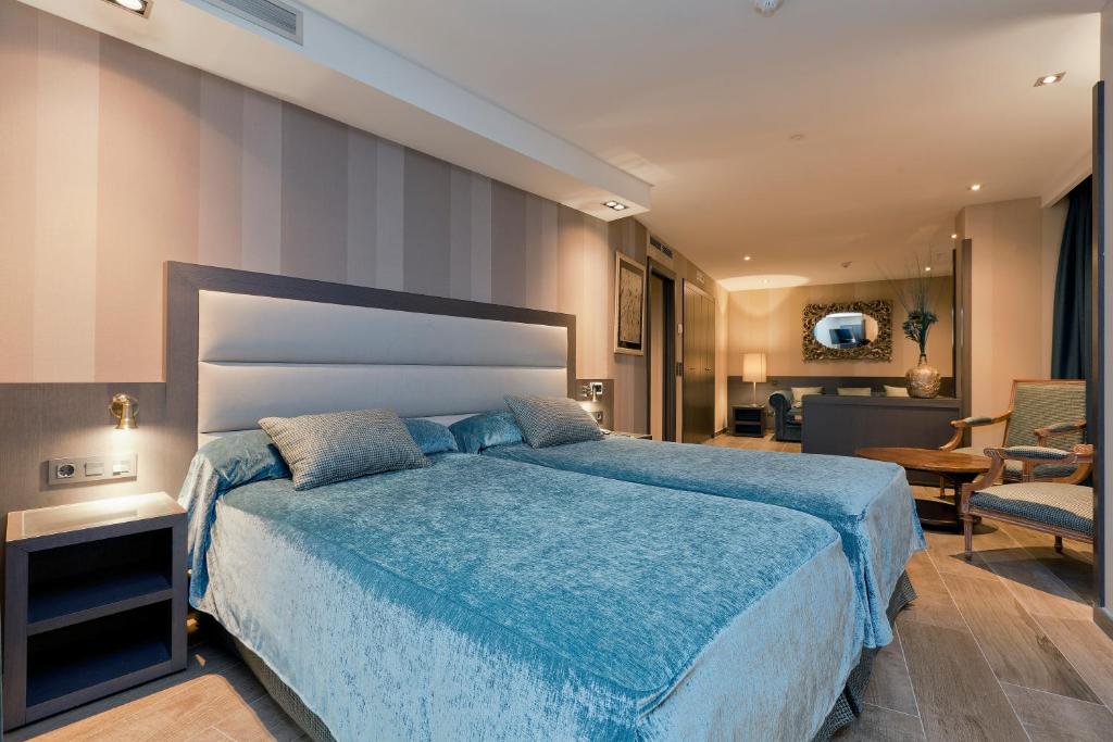 Cama o camas de una habitación en Hotel Reina Cristina