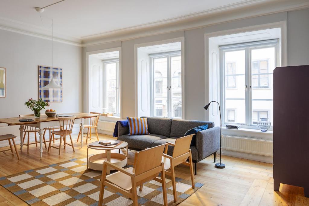 a living room with a couch and a table at Gamla Stan Apartments in Stockholm