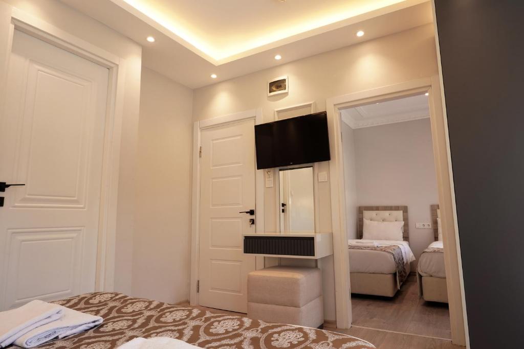 Postel nebo postele na pokoji v ubytování Ararat Hotel