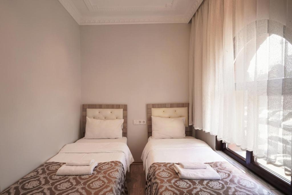 Postel nebo postele na pokoji v ubytování Ararat Hotel
