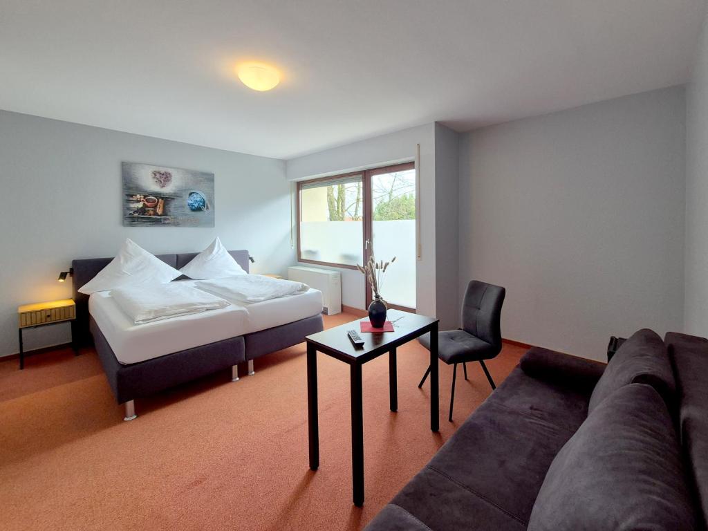 Postel nebo postele na pokoji v ubytování Hotel Schachener Hof