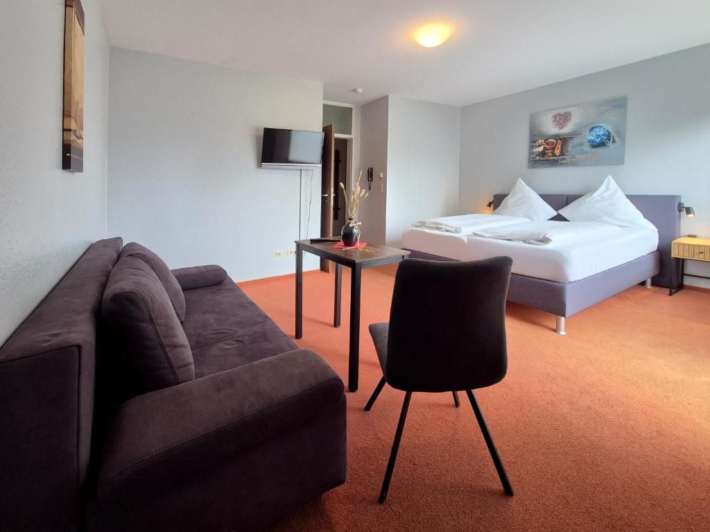 Postel nebo postele na pokoji v ubytování Hotel Schachener Hof