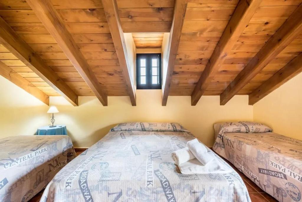 A bed or beds in a room at Panoramic View Villa Almogía