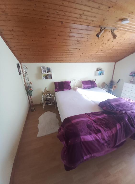 Uma cama ou camas num quarto em Pension Prem
