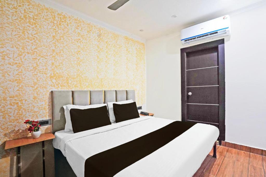 Postel nebo postele na pokoji v ubytování TWAMEV RESIDENCY