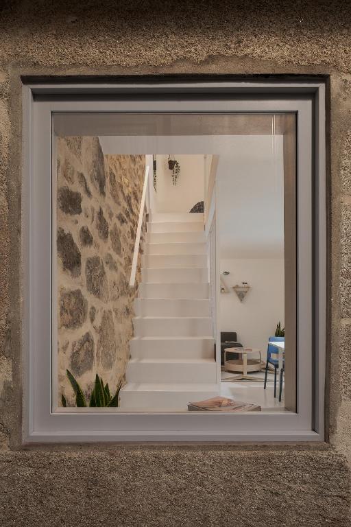 a view of a staircase through a window at Casa Dorado in Pontevedra