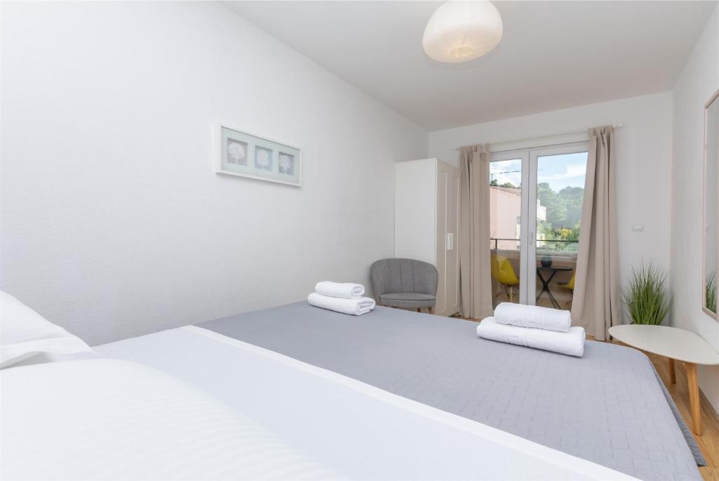 Postel nebo postele na pokoji v ubytování Apartments Marijo