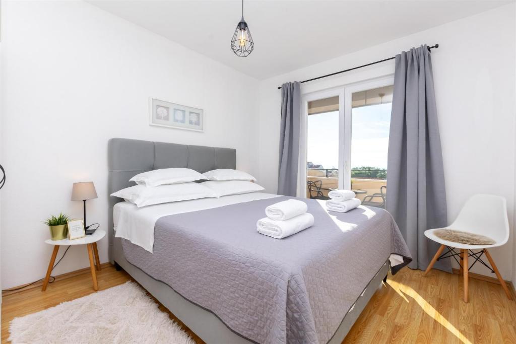 Postel nebo postele na pokoji v ubytování Apartments Marijo