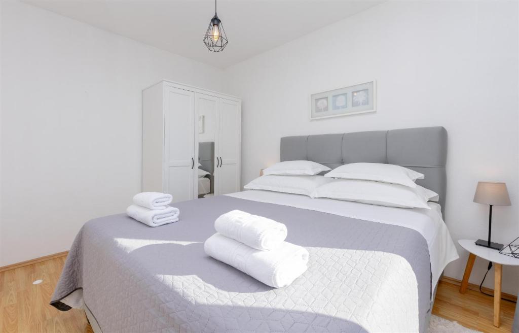 Postel nebo postele na pokoji v ubytování Apartments Marijo
