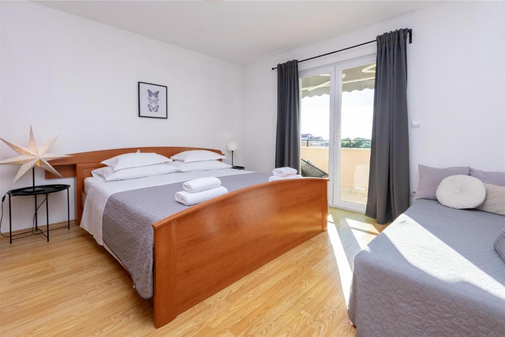 Postel nebo postele na pokoji v ubytování Apartments Marijo