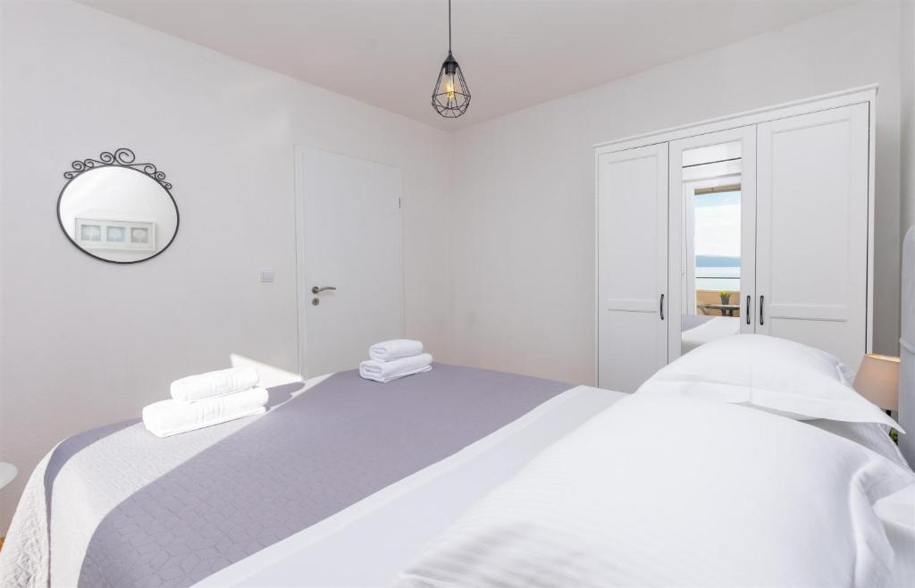 Postel nebo postele na pokoji v ubytování Apartments Marijo