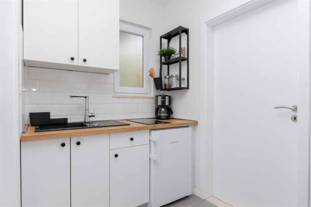 Kuchyň nebo kuchyňský kout v ubytování Apartments Marijo