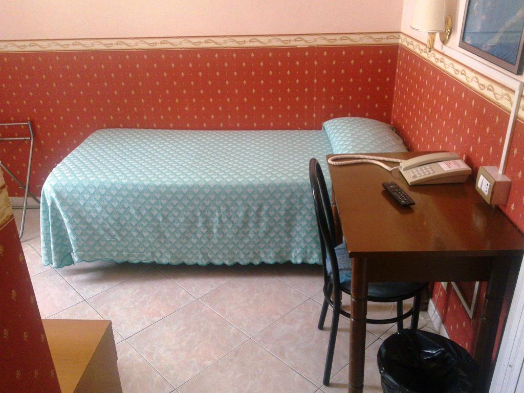 Postel nebo postele na pokoji v ubytování Hotel Lazzari