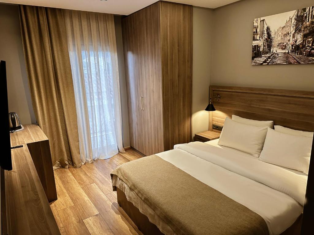 Postel nebo postele na pokoji v ubytování Viola Hotel Budva