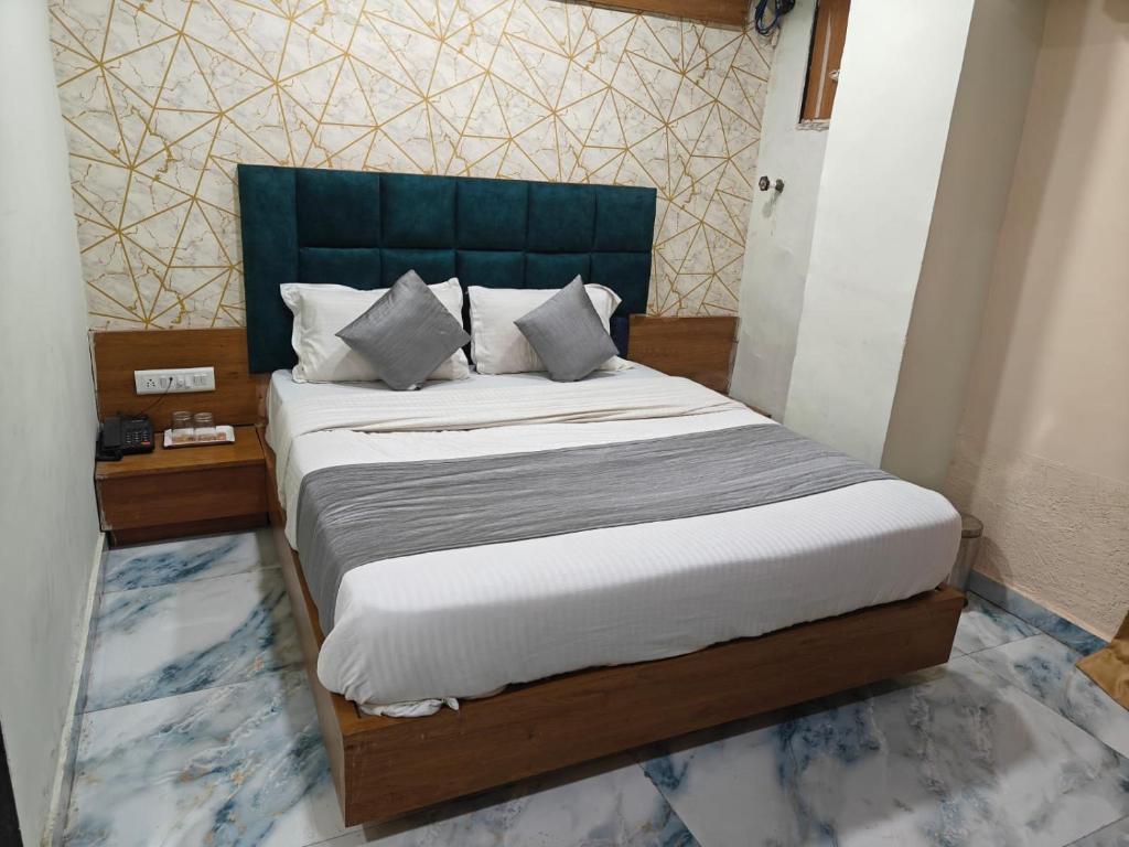 Postel nebo postele na pokoji v ubytování Hotel Royal King