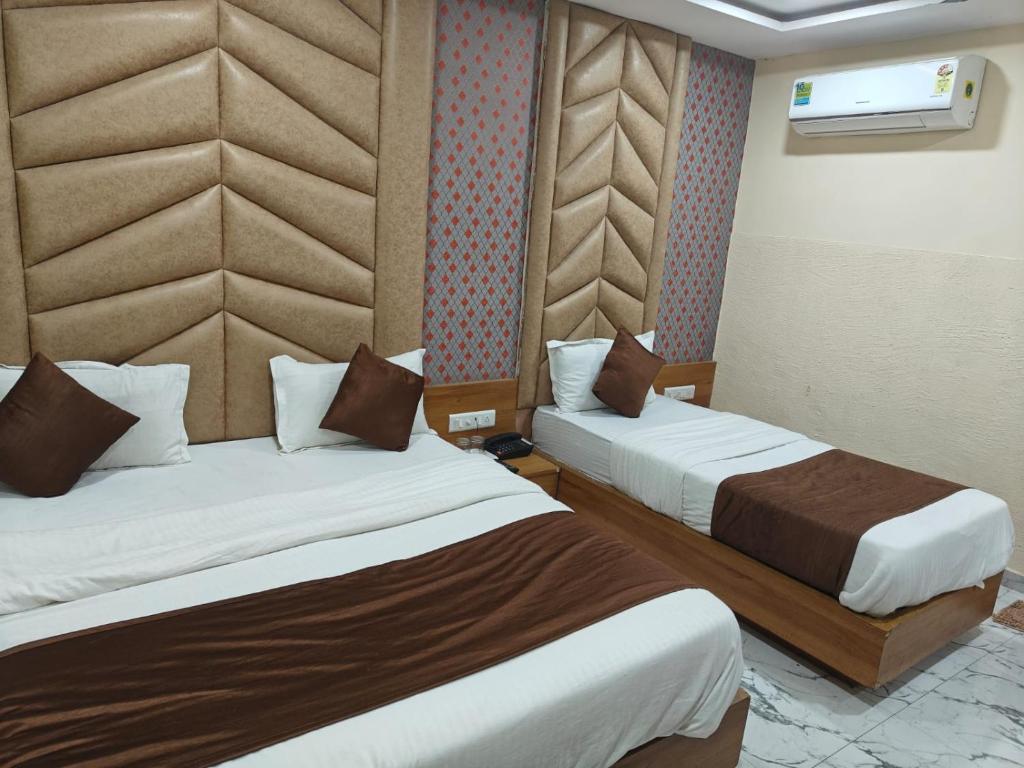 Postel nebo postele na pokoji v ubytování Hotel Royal King
