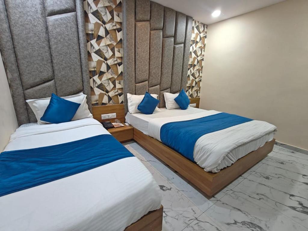 Postel nebo postele na pokoji v ubytování Hotel Royal King