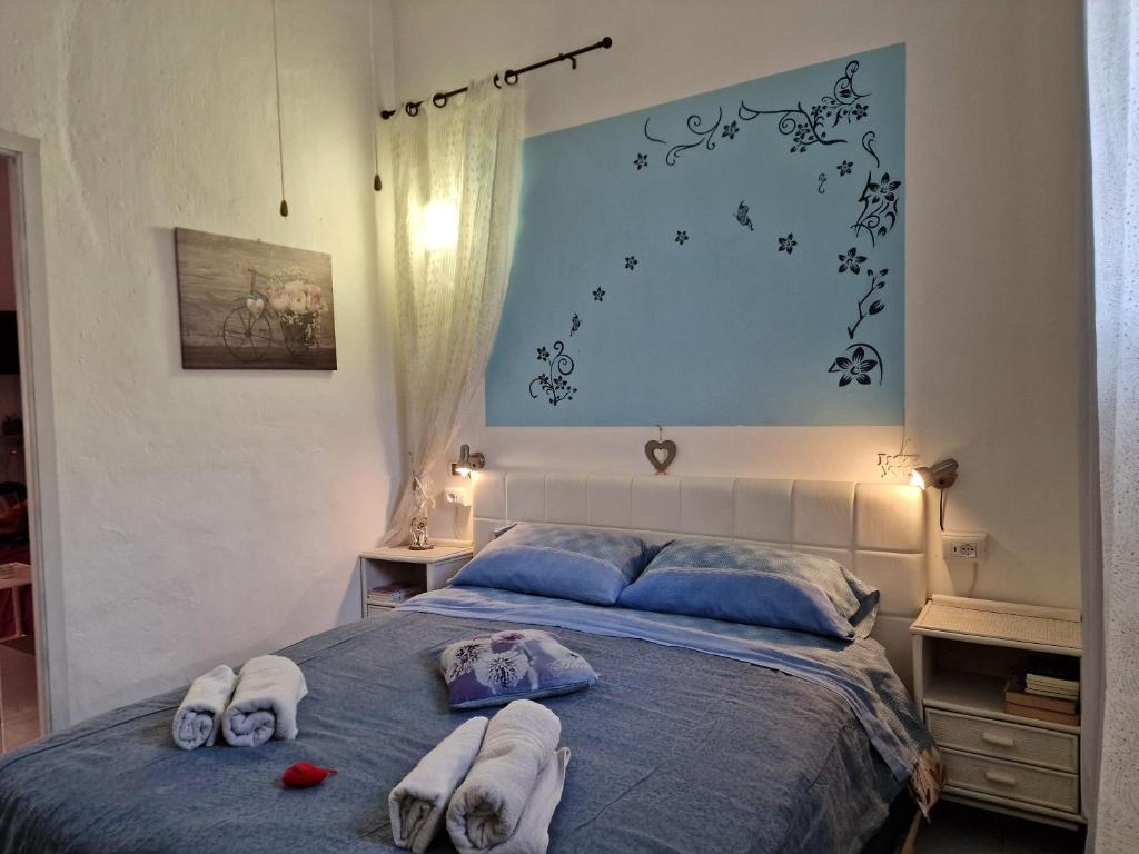 A bed or beds in a room at Casa Albergheria