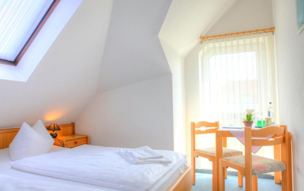Postel nebo postele na pokoji v ubytování Hotel Nordwind