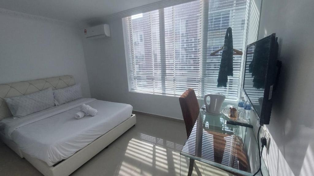 Postel nebo postele na pokoji v ubytování ONE AMPANG HOTEL