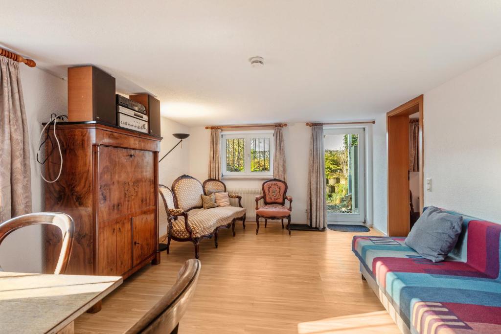 a living room with a couch and chairs at Zwei-Zimmer-Wohnung in Schopfheim in Schopfheim