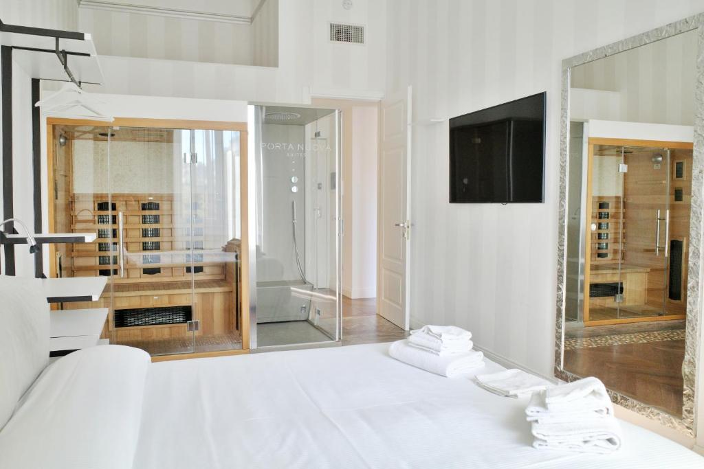 Postel nebo postele na pokoji v ubytování PORTA NUOVA SUITES