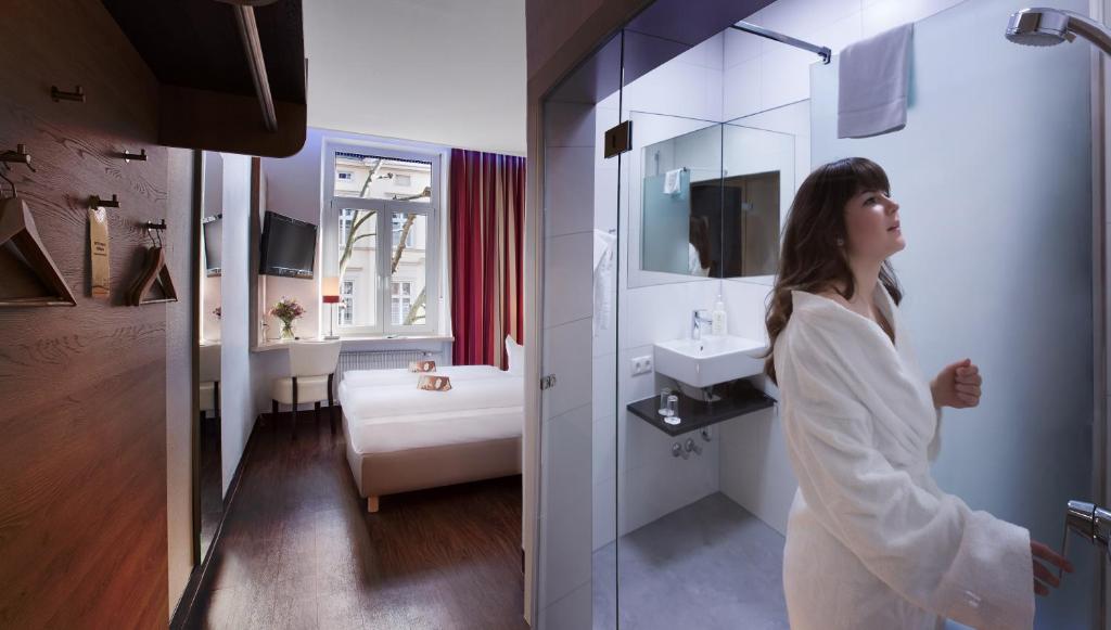 Postel nebo postele na pokoji v ubytování Hotel National